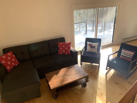 Living room #1 with access to the wrap around porch. 