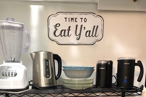 Blender, hot water warmer, coffee grinder, milk steamer, serving dishes.