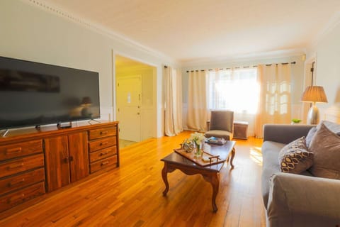 The doorway to the right of the window in this photo leads to a bedroom.