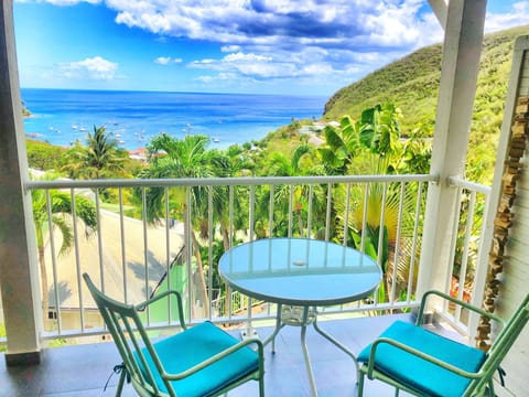 A balcony overlooking the Caribbean. Tillet apartment. O Coeur de Deshaies residence.