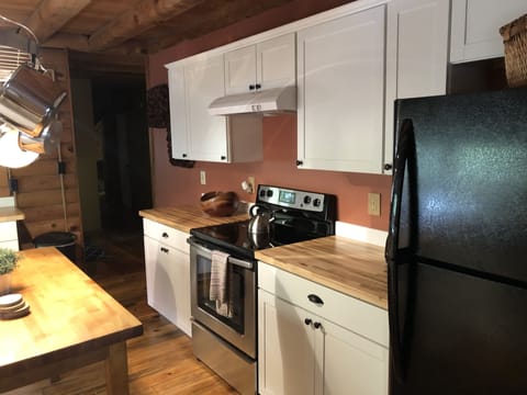 Rustic kitchen stove/oven and countertop area