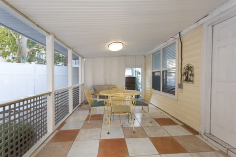 Relax outside in the screened in porch with seating for four.