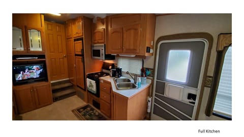 Includes dishes, cookware, coffee maker, and toaster. Gas Range and oven.