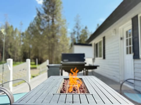 Propane fire pit and grill on the back deck.