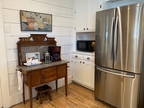 Coffee Bar, Microwave and Stainless Steel Fridge. 
