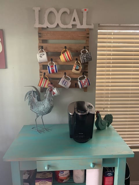 Coffee bar w/ a Keurig and a regular coffee maker on the counter. 