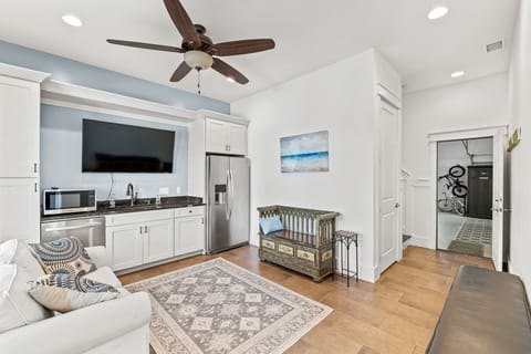 Ground floor kitchenette with refrigerator, dishwasher, washer & dryer closet