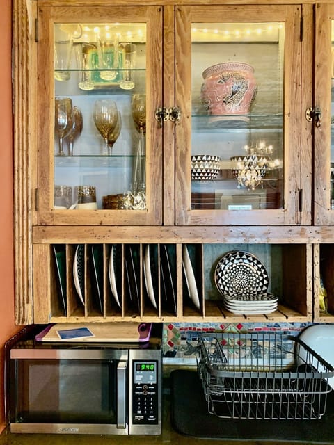 Hand blown glass goblets along with antique amber glasses. 