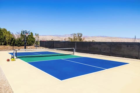 Serve, smash, or shoot—this versatile outdoor court is ready for action! Enjoy a scenic match of pickleball or switch things up with a friendly game of basketball, all set against a stunning desert mountain backdrop. 