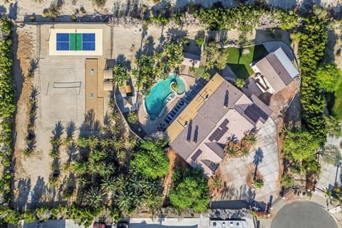 Zoom out and feast your eyes on the ultimate backyard glow-up — a desert resort-style playground carved right into the palms.