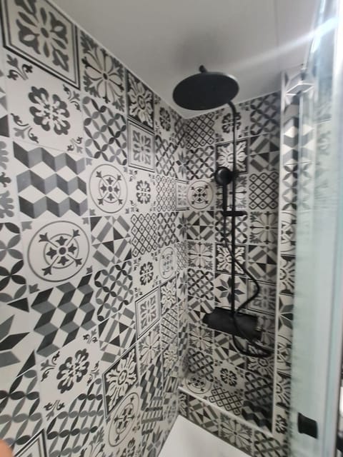 With a big shower head and small movable shower head