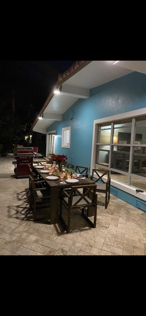 Teak Dining Table with 8 arm chairs for fun evenings relaxing under the stars