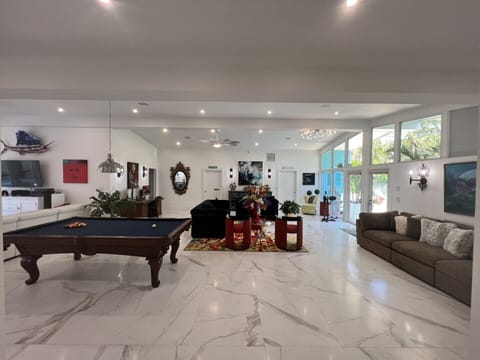 Huge Windows overlook your private pool in front and 80' Waterfront at back