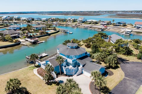 Stunning waterfront property with private dock access and panoramic views of the inlet bay and coastal community.