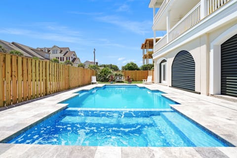 Dive into your private pool oasis, where crystal-clear waters await your perfect vacation moments under sunny skies.