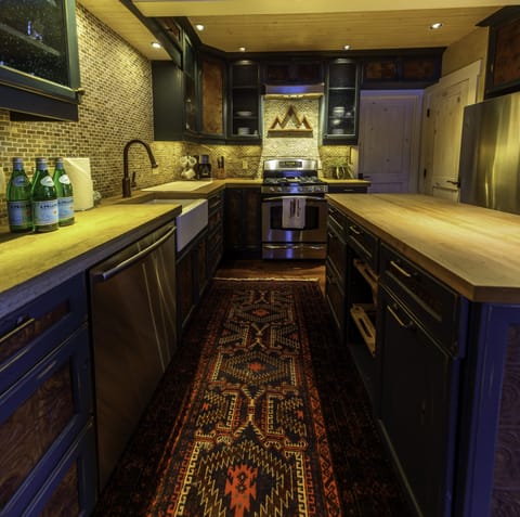 Fully stocked kitchen with stainless steel Kitchen Aide appliances. 