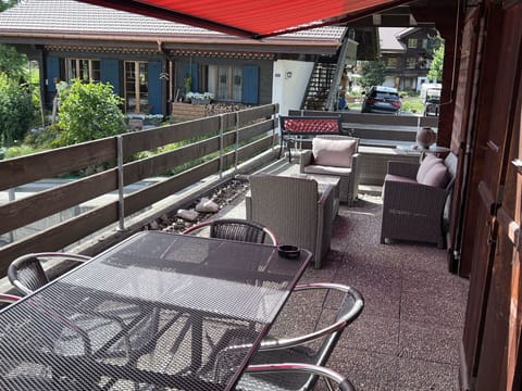 Building, Plant, Outdoor Furniture, Outdoor Table, Shade, Window, Motor Vehicle, House, Leisure, Chair