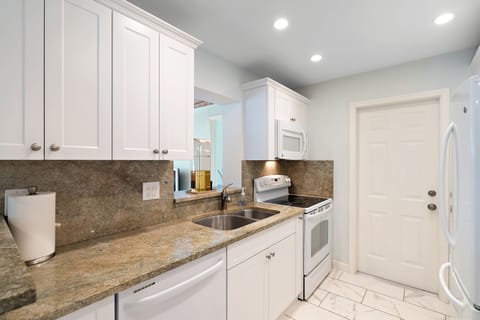 Kitchen ready for cooking. Pots, pans, tools. Juicer+ hand blender on request