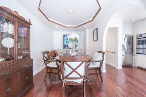 Beyond the living and kitchen area is the dining room, with seating for four.
                