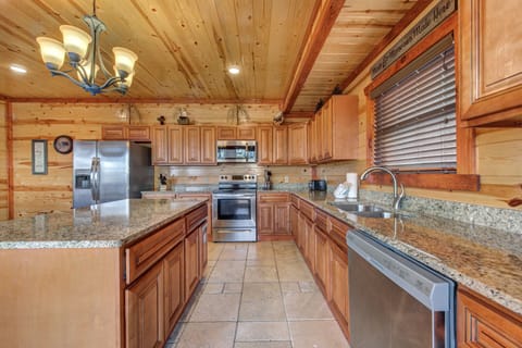 Cook your favorite meals in this large kitchen equipped with your basic kitchen utensils.