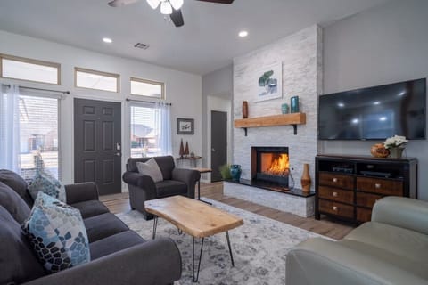Cozy living room with fireplace, perfect for relaxing after a long day.
