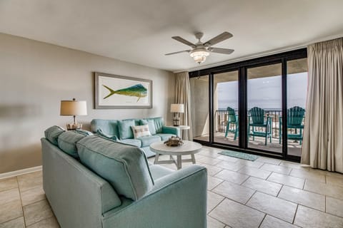 Gulf-front living room with wet bar and comfortable seating at Wind Drift Orange Beach