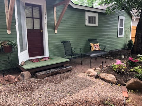 The back of the cottage has a lovely patio to enjoy views of Pikes Peak.