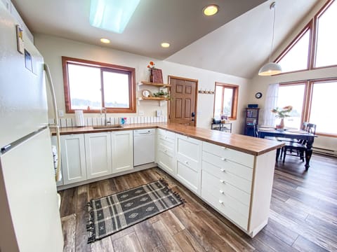 Kitchen has everything needed to make meals, plus a view.
