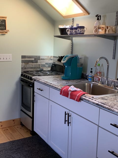 Full kitchen with stove-top range, oven, an sink