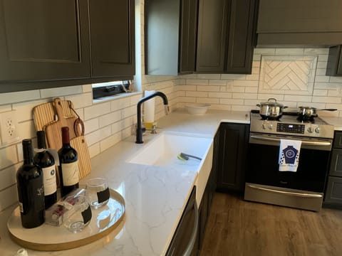 Well-equipped kitchen with farmhouse sink.