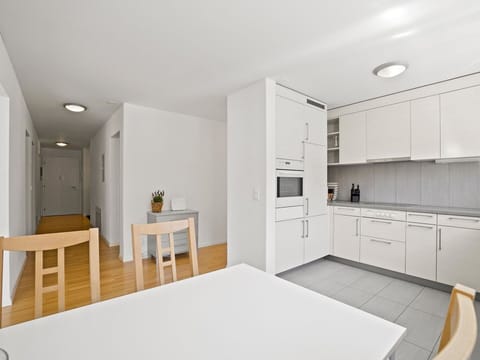 Cabinetry, Furniture, Wood, Table, Interior Design, Floor, Houseplant, Chair, Flooring, Door