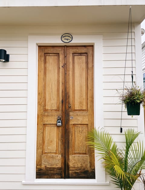 Private entrance at rear of gated property through shared courtyard.