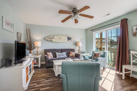 Roomy living room with TV and a beachy vibe!!