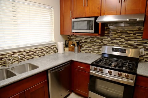 Kitchen includes appliances: Gas Stove, Dishwasher, Microwave Oven, Refrigerator