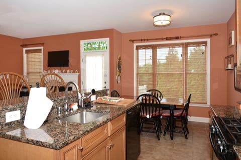 Kitchen/Dining area provides dining for 8 plus an additional table on the deck through the door off the dining area!