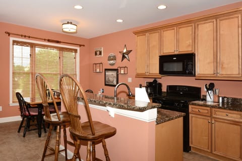 Breakfast bar is a great spot to sit and keep the cook company!