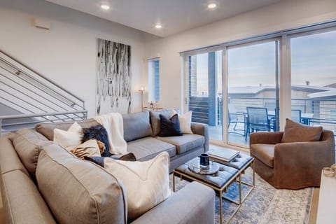 Living Room: Stylish space with panoramic views, plush seating, and sleek decor!