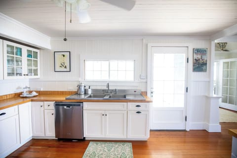 Kitchen with ocean views. Access to deck for BBQ. 