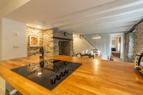 Ground floor: Kitchen with flagstone floor and underfloor heating