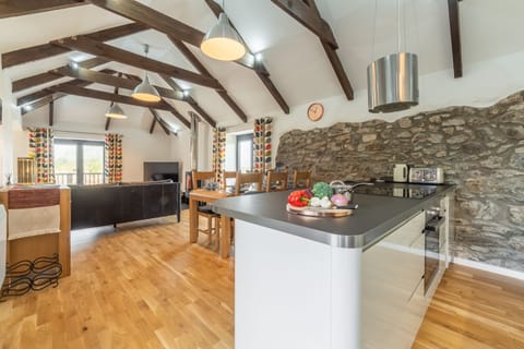 Hunter's Barn, St Agnes. The kitchen overlooks both the dining and living areas