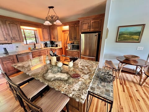 Bright And Well-Appointed Kitchen with Massive Island with Extra Seating!