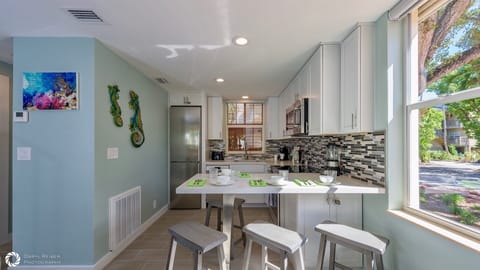 The fully equipped kitchen has brand new stainless steel appliances...