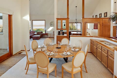 Dining for 8 around the large table with more seating in the kitchen