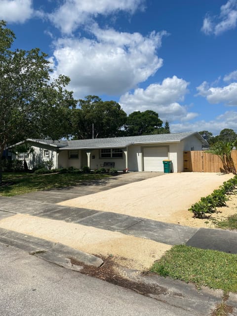 Front yard with new crushed coquina extra parking area 