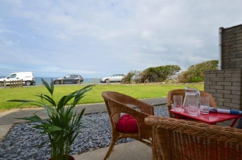 Foreshore At Fistral, Newquay. Private patio overlooking the beach which leads to communal gardens