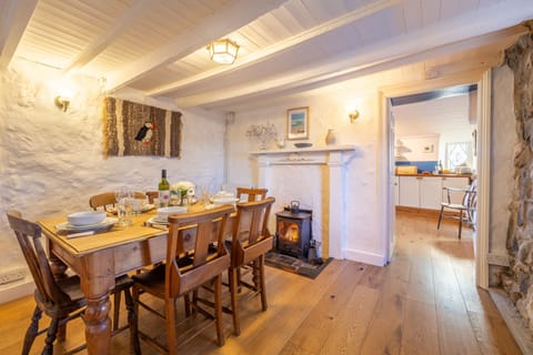 Scrumbles Hollow, St Agnes. Ground floor: Dining room with cosy wood burning stove