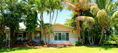 Front of property. Rental w/ private entrance around back. Solar panels on roof.