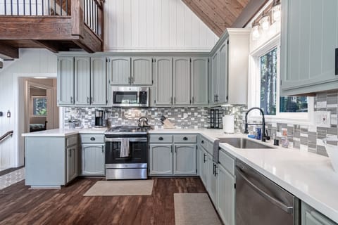 Newly remodeled kitchen with new appliances and plenty of cooking utensils 