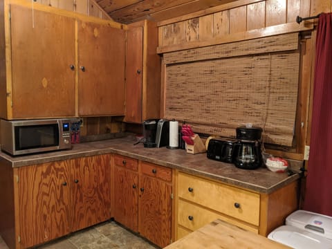 Kitchen includes Microwave Oven, knives, toaster, 2 different coffee pots.