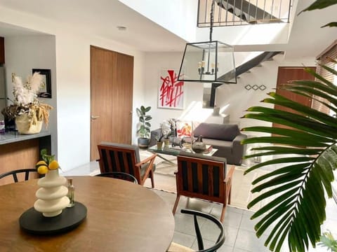 Our sun-drenched living room that opens out to a large terrace and overlooks 180-degree views of tree tops, is our favorite place to be. Wether you're reading a book, entertaining or cooking up a feast, this is the place where time flies by.